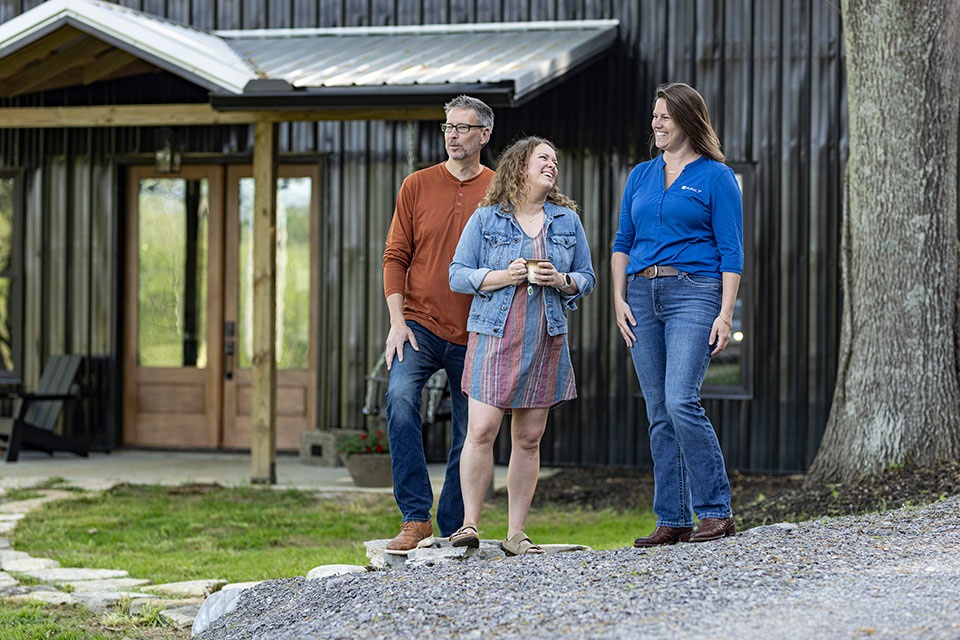 Couple meeting with loan officer to discuss the cost to build their barndo