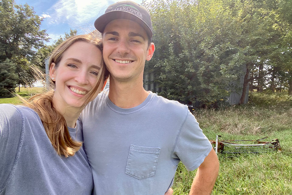 Couple stand on rural land financed by Rural 1st.