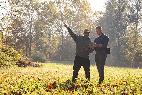 Man and loan officer look at a drone receiver