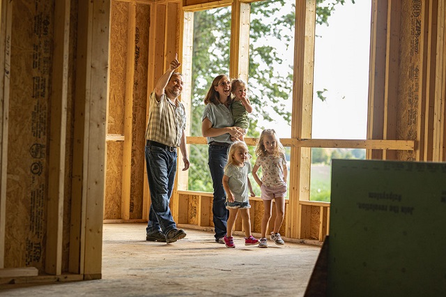 Stroud Family family walks their new home under construction