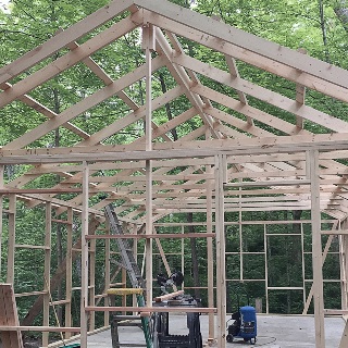 Framing of 4-H cabin being built.